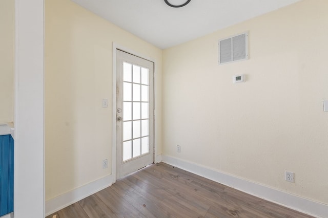 spare room featuring hardwood / wood-style flooring