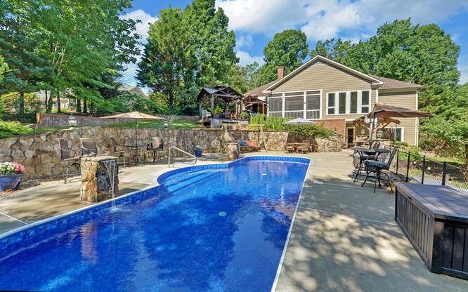 view of swimming pool featuring a patio area