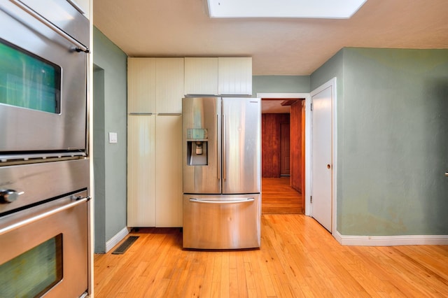 241 Boulevard St, Murphy, NC 28906 - kitchen with stainless steel appliances, light wood-type flooring, and baseboards