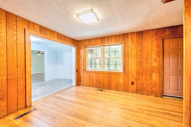 241 Boulevard St, Murphy, NC 28906 - spare room with wood finished floors, wooden walls, and ceiling fan