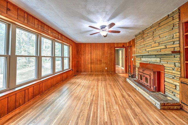 241 Boulevard St, Murphy, NC 28906 - unfurnished living room with light wood finished floors, wood walls, and a ceiling fan