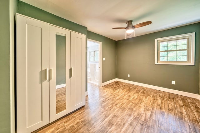241 Boulevard St, Murphy, NC 28906 - unfurnished bedroom with light wood finished floors, baseboards, and ceiling fan