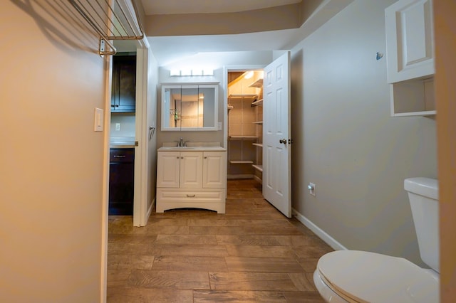 241 Boulevard St, Murphy, NC 28906 - bathroom featuring toilet, wood-type flooring, vanity, and baseboards