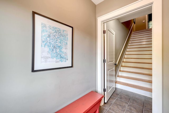 staircase with tile patterned flooring