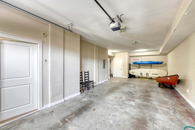 garage featuring baseboards and a garage door opener