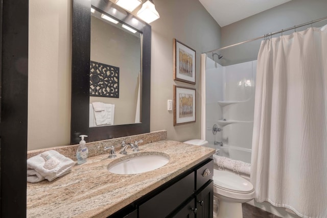 bathroom featuring vanity, toilet, and shower / bath combo with shower curtain