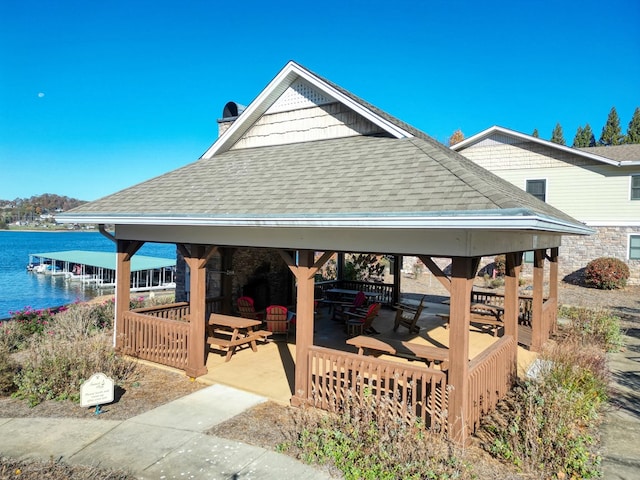 view of patio / terrace with a gazebo and a water view