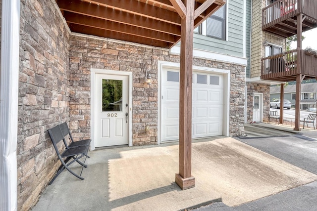 entrance to property featuring stone siding