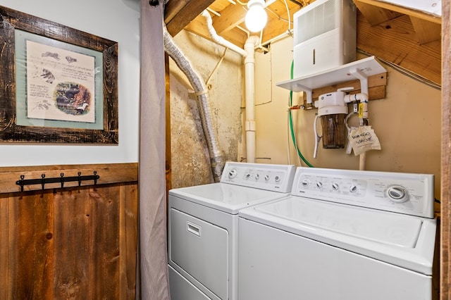 washroom featuring washer and clothes dryer