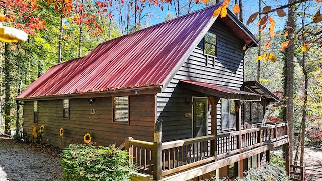 view of home's exterior with a wooden deck