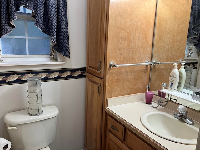 bathroom with vanity and toilet