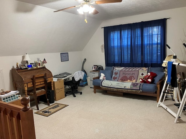 office with lofted ceiling, a textured ceiling, carpet flooring, and ceiling fan