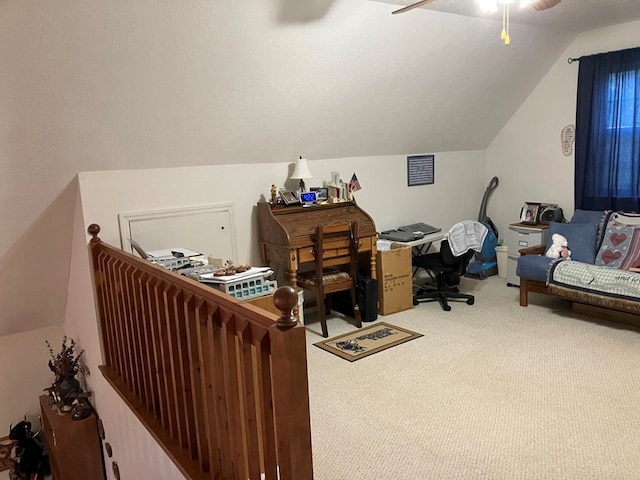 carpeted office space with lofted ceiling and ceiling fan