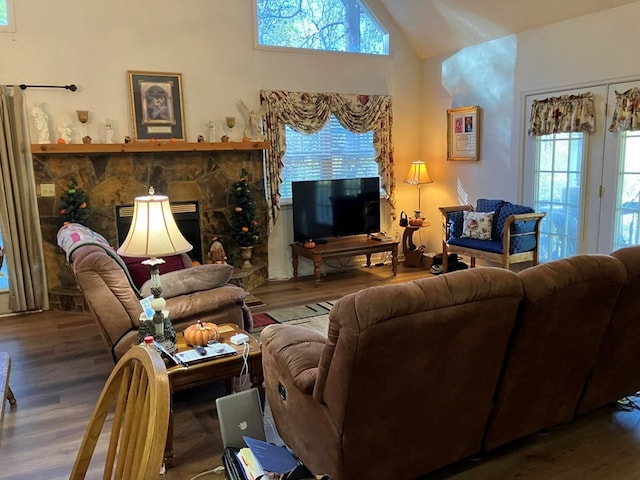 living room featuring hardwood / wood-style floors and vaulted ceiling