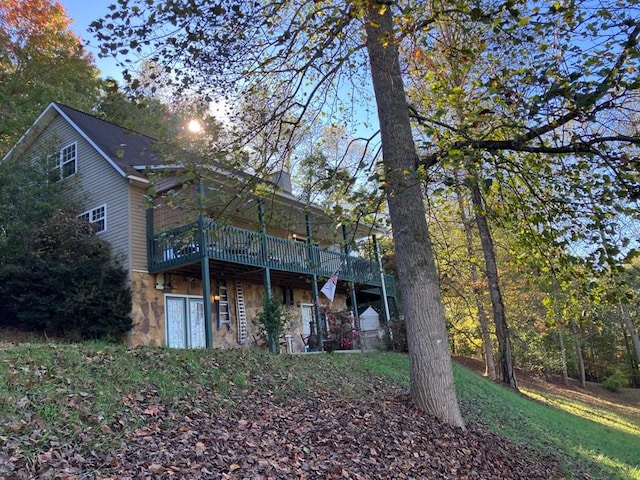 back of property featuring a deck