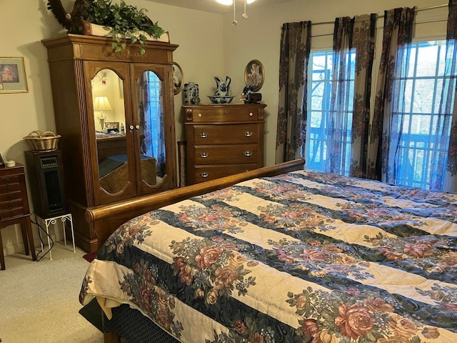 bedroom with light colored carpet