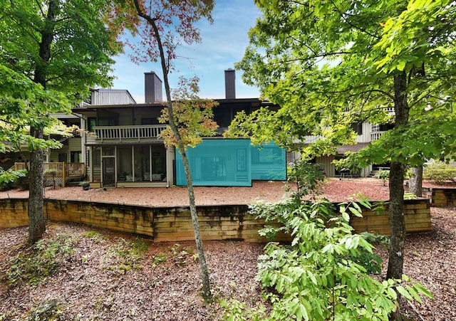 rear view of house with a balcony