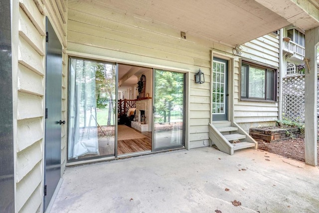 doorway to property with a patio area
