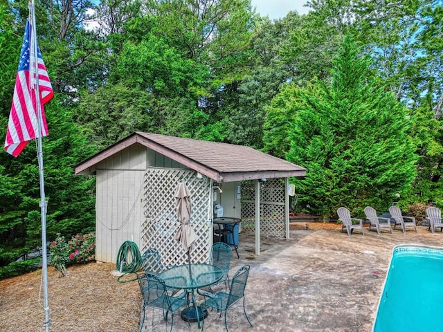 view of patio featuring a storage unit