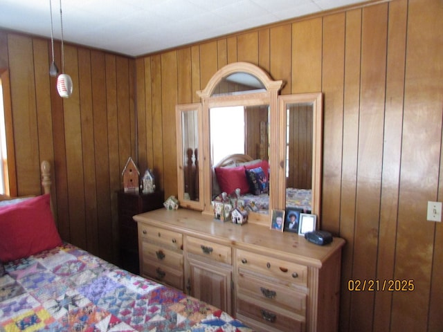 bedroom with wooden walls