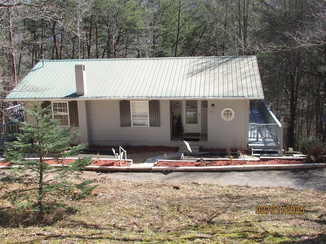 view of front of home featuring metal roof