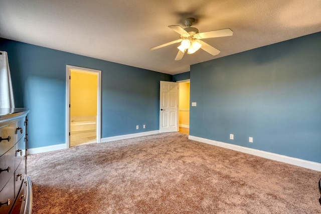 unfurnished bedroom with ceiling fan, carpet, and ensuite bath