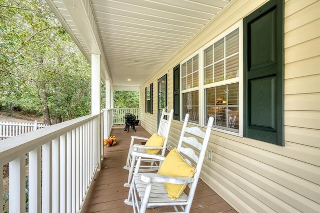 wooden terrace with a porch