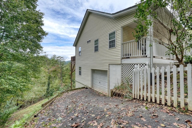 view of property exterior featuring a garage