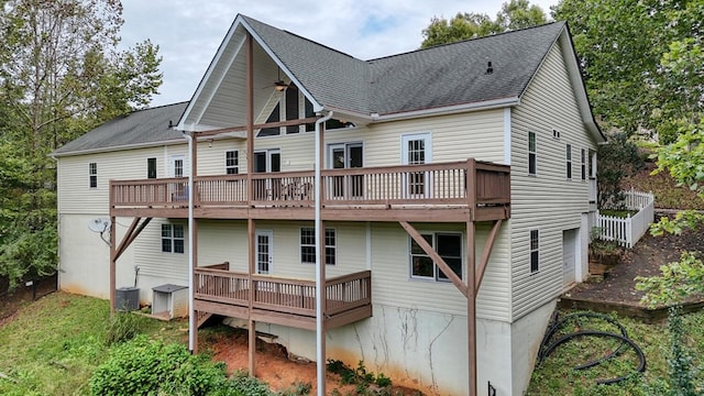 back of property featuring central AC unit and a deck