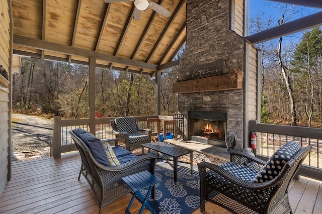 wooden deck featuring an outdoor living space with a fireplace and ceiling fan