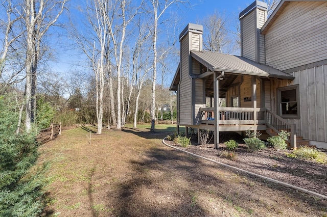 view of yard featuring covered porch