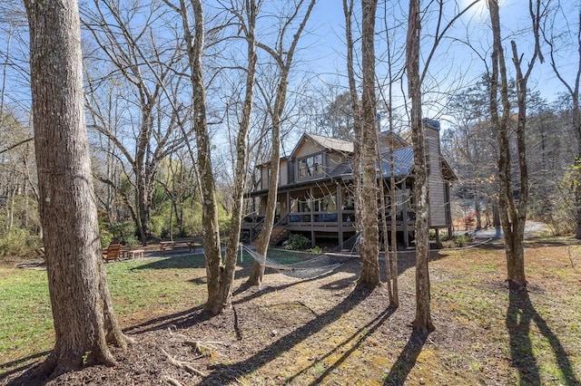 view of yard with a wooden deck