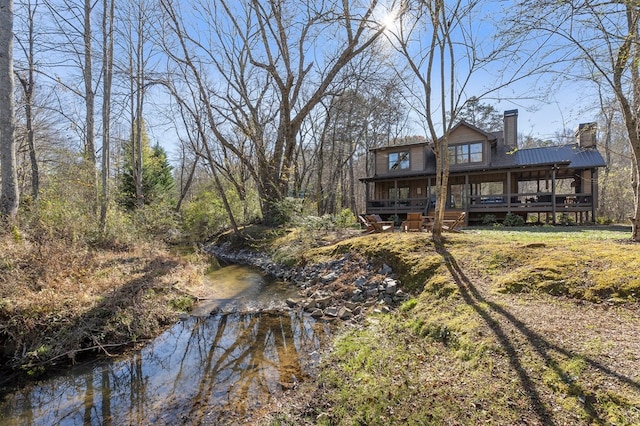 rear view of property with a porch