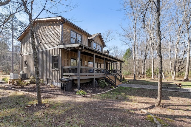 view of property exterior featuring a porch and central air condition unit