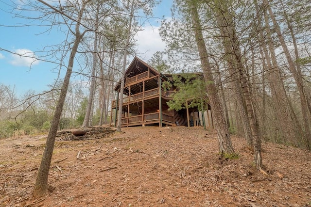 back of property featuring a deck