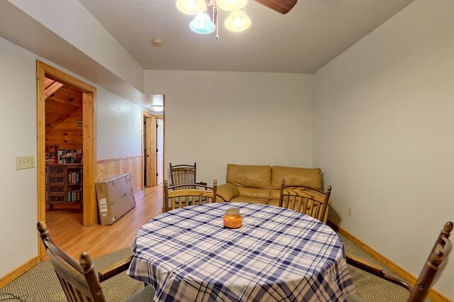 dining room with light wood-type flooring and ceiling fan