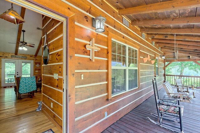 wooden deck with french doors and ceiling fan