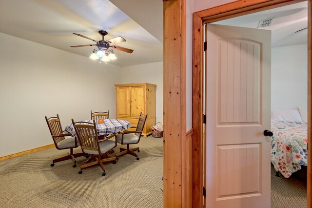 dining room with carpet and ceiling fan