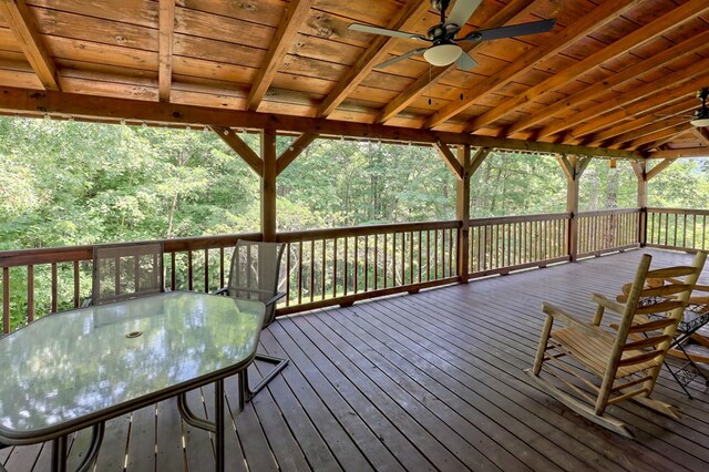 wooden terrace featuring ceiling fan