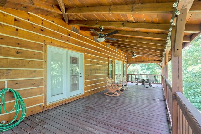 wooden terrace with french doors and ceiling fan