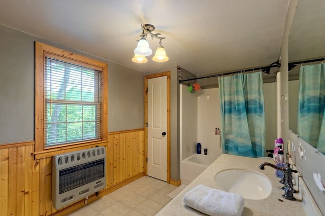 bathroom featuring wood walls, tile patterned floors, heating unit, and shower / bathtub combination with curtain