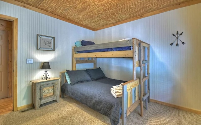 bedroom featuring wooden ceiling and baseboards