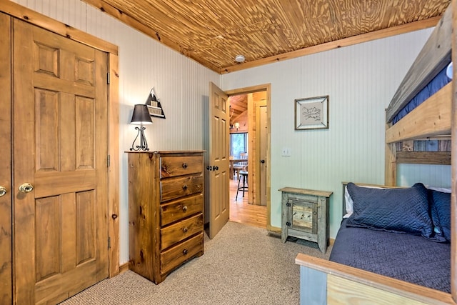 carpeted bedroom featuring wooden ceiling