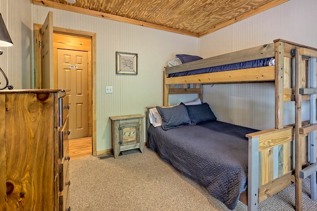 bedroom featuring carpet flooring and wood ceiling