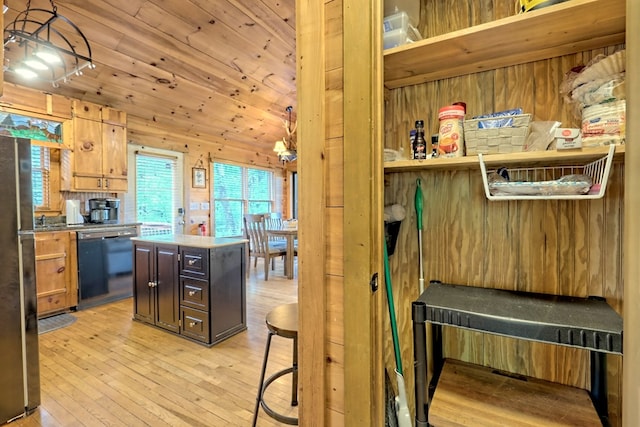 kitchen with wooden walls, dishwasher, light wood-type flooring, wooden ceiling, and freestanding refrigerator