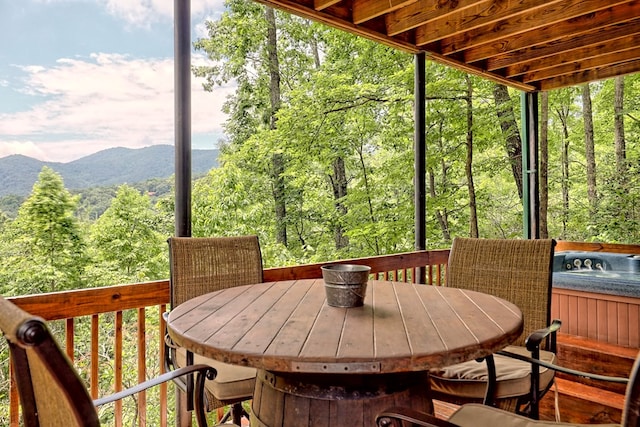 sunroom / solarium with a forest view