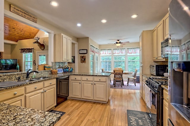 kitchen with wooden ceiling, black appliances, ceiling fan, light hardwood / wood-style floors, and kitchen peninsula