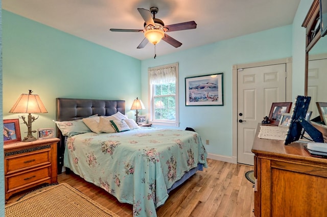 bedroom with light hardwood / wood-style flooring and ceiling fan