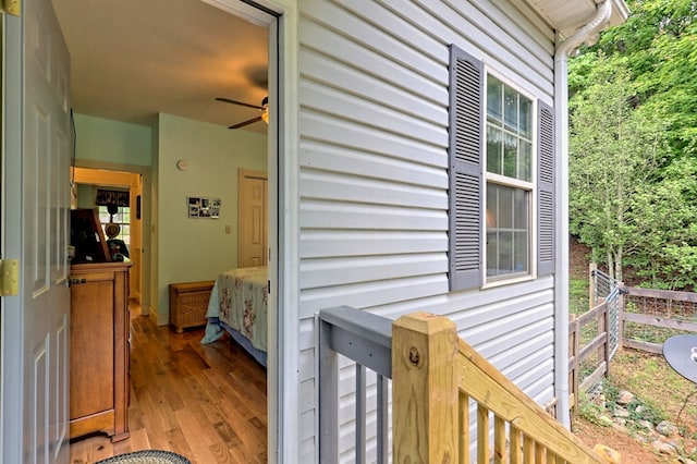 exterior space with hardwood / wood-style floors and ceiling fan