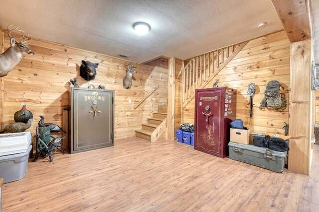 interior space featuring wood walls and hardwood / wood-style floors